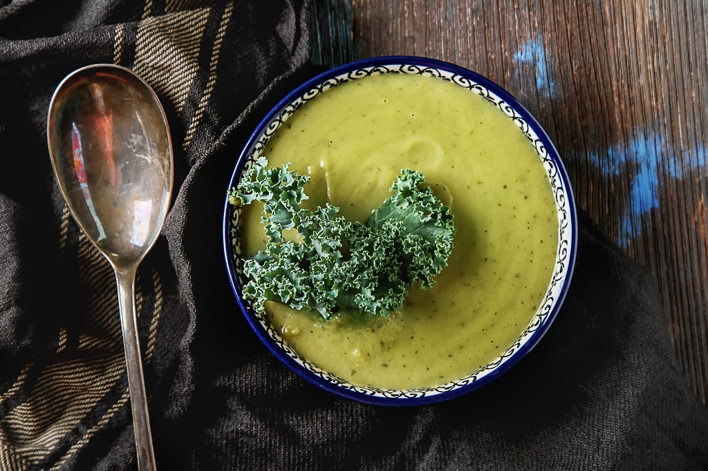 A bowl of Kale Soup and a spoon