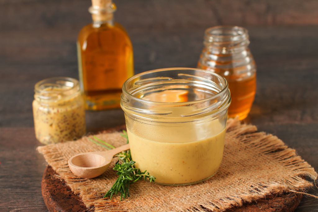 Bowls of Honey mustard and a spoon