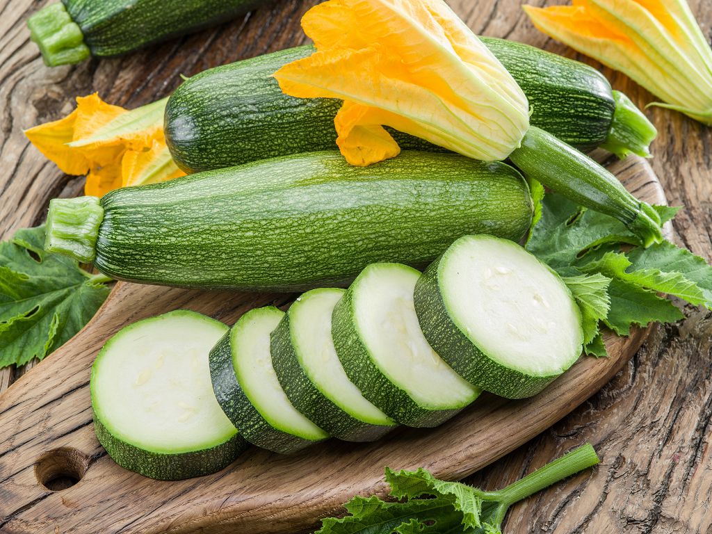 Zucchini and sliced Zucchini on the chopping board