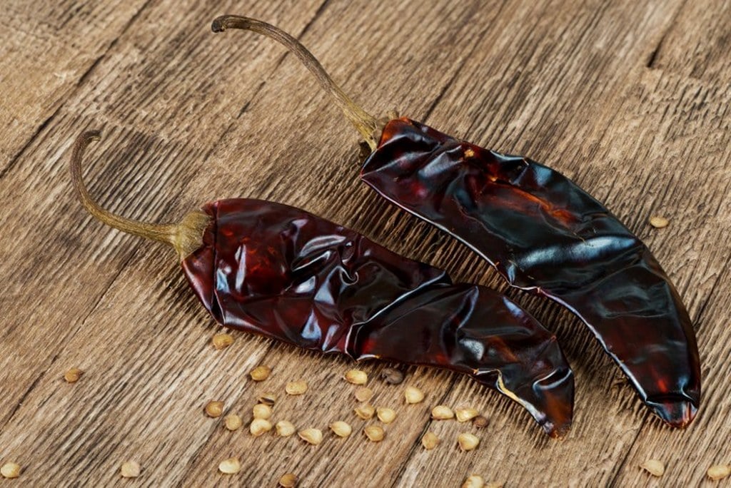 Guajillo peppers and seeds on the table