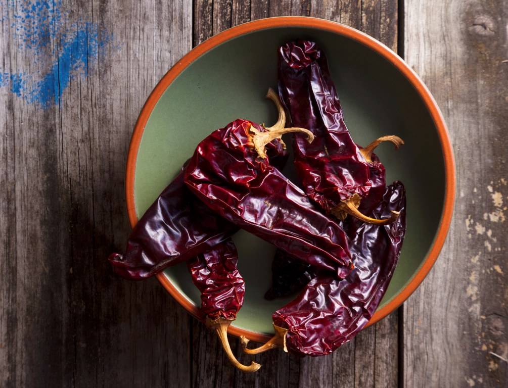 a cup of Guajillo peppers on the table