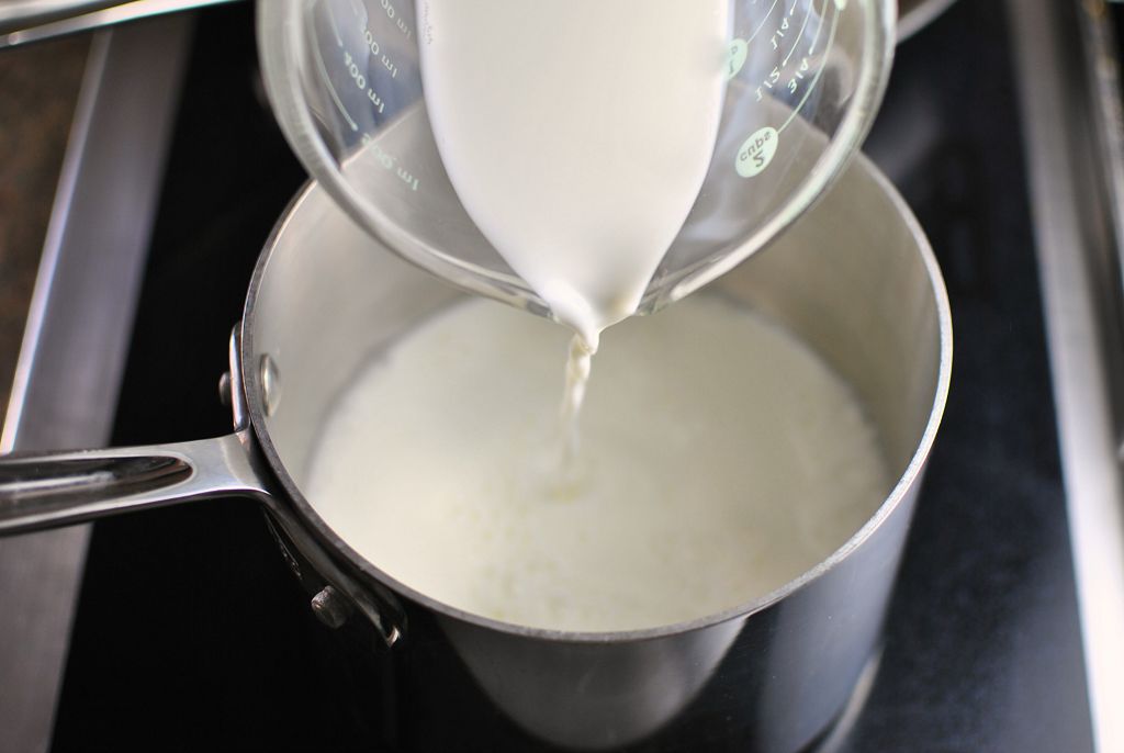 Stir in the milk and cream then transfer to a double boiler