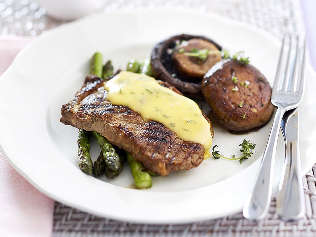 Grilled Beef Steak and vegetables on the plate and forks