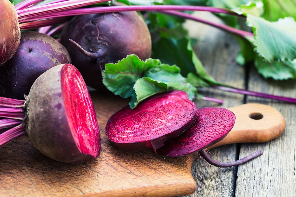 Beets and slices of Beets on the chopping board