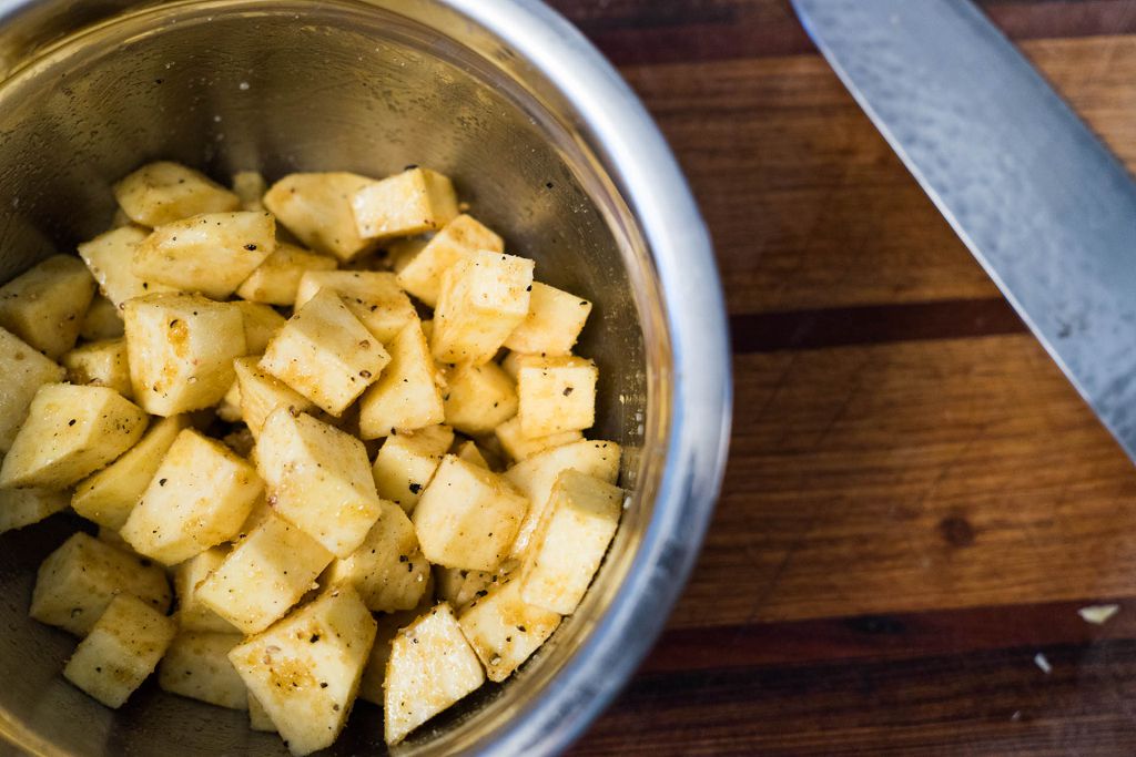 Add the potato cubes and season with salt and pepper