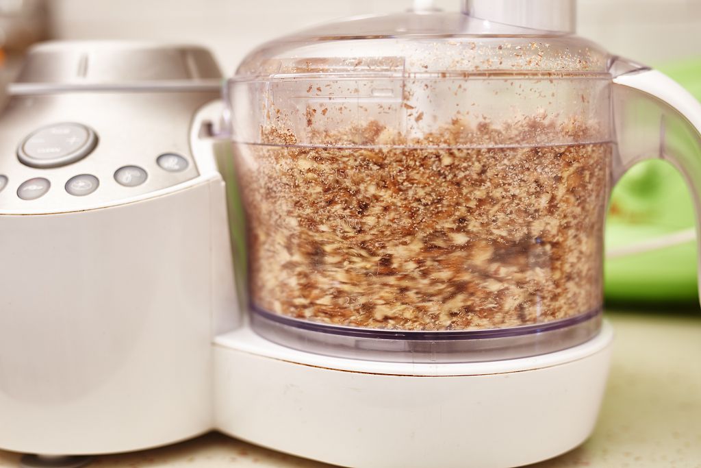 Pulse the walnuts with the use of a food processor