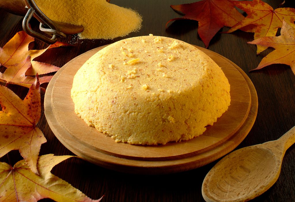 Cornmeal With Corn Flour on the chopping board and a spoon