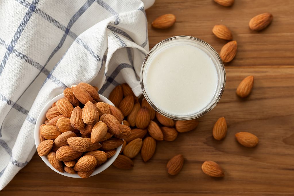 A cup of Almond milk and a bowl of Almond