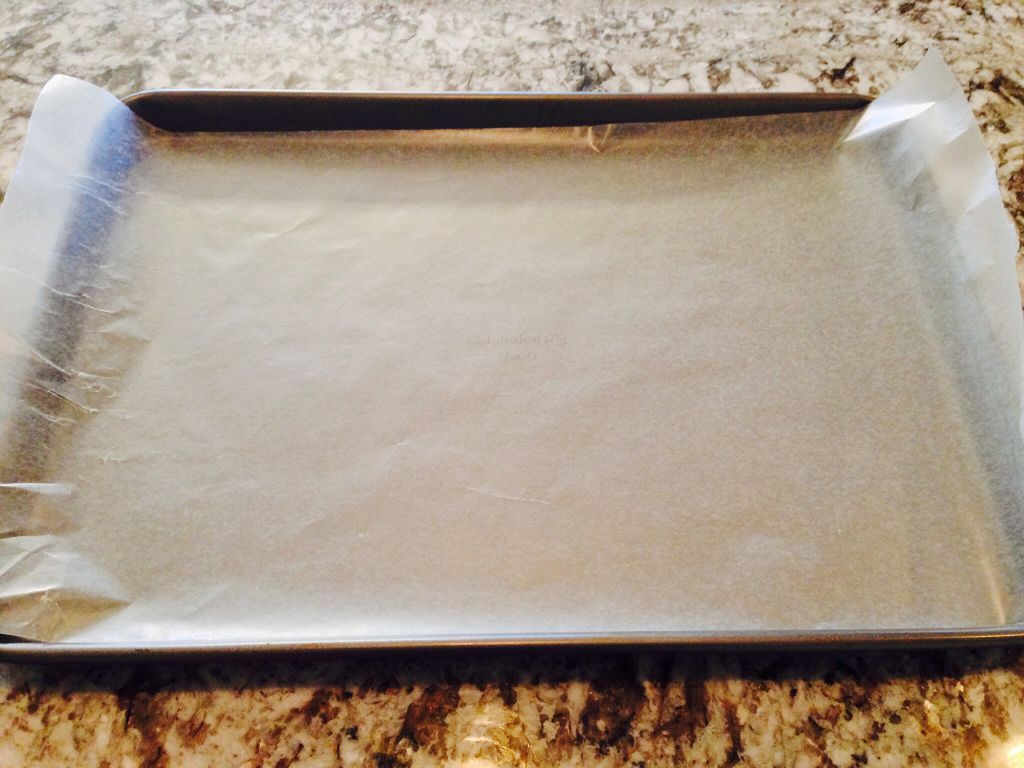 Line the bottom of the cookie sheet with wax paper