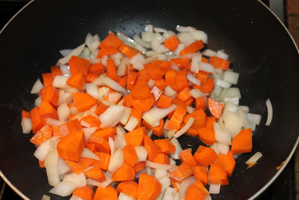 Saute the onion and carrots in the drippings until tender.