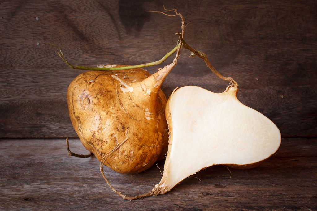 Jicama and slices of Jicama on the table