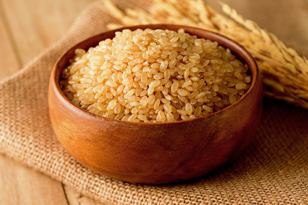 A bowl of Uncooked Rice on the table