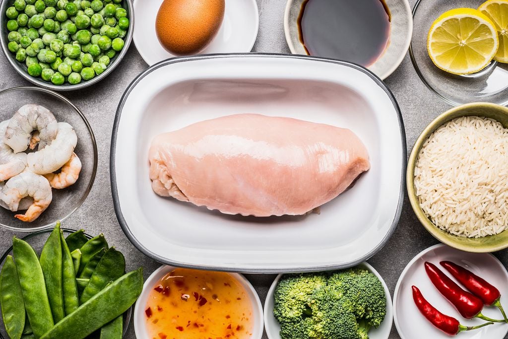 skinless chicken breasts, condensed cream of chicken soup, uncooked white rice, bread crumbs, onion powder, Salt and pepper