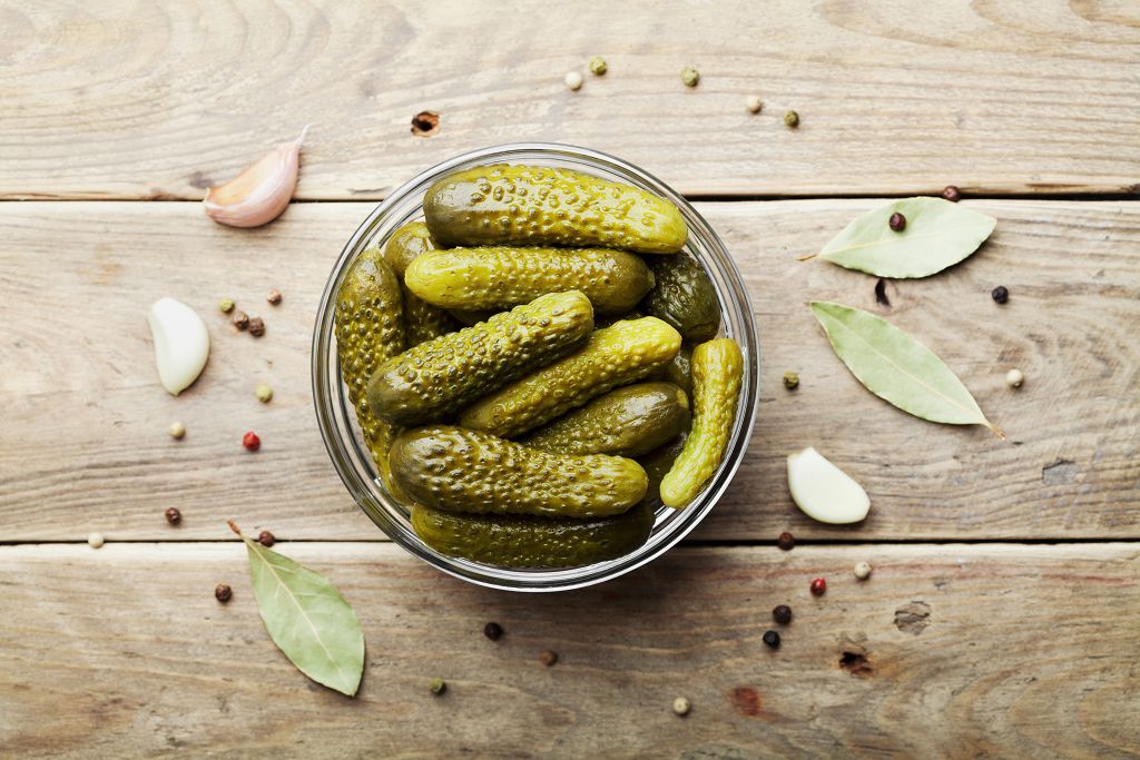 A bowl of pickles on the table