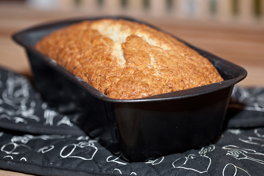 A Loaf Pan with bread on the table