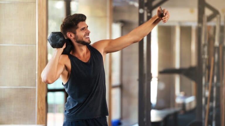 Fitness man makes selfie