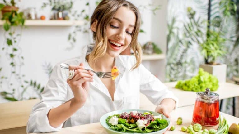 Woman eating salad