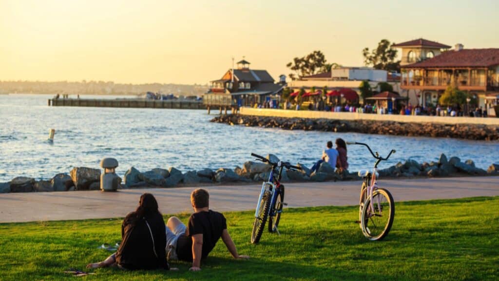 Bike riders watch sunset in San Diego Waterfront Public Park