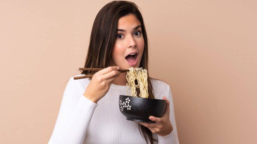 Girl eating noodles