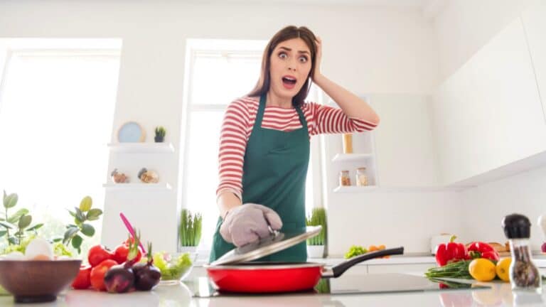 Upset young woman made mistake in cooking