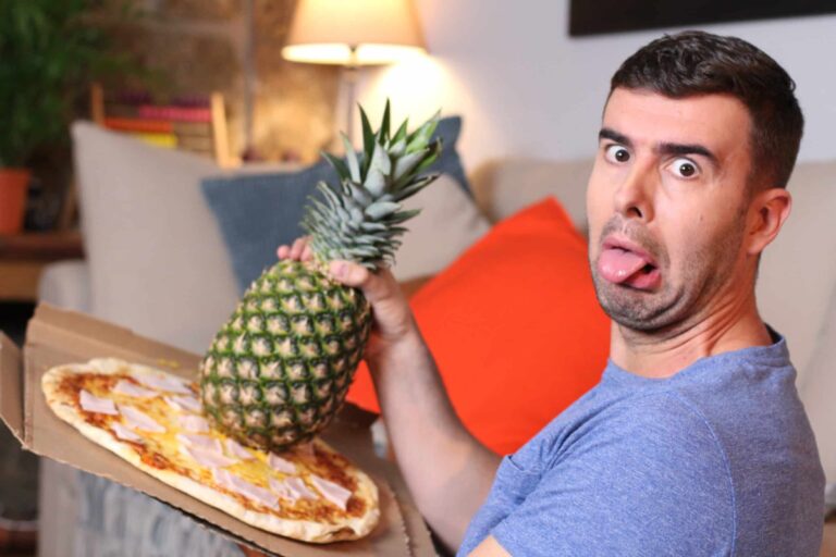 Grossed out Man Holding Pineapple