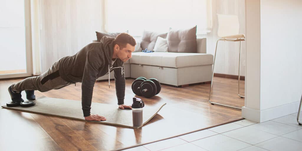 Exercising in Living Room Man