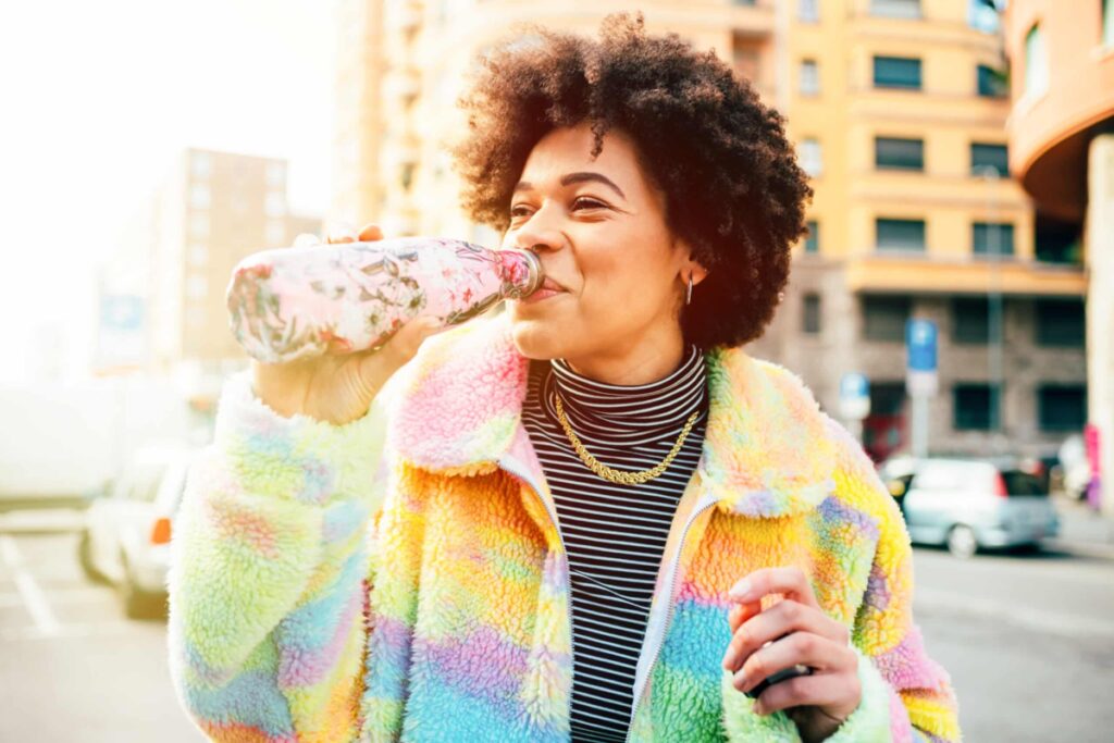 Woman Drinking Water Reusable Bottle